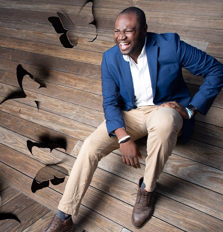 Man on wooden steps with butterfly cutouts