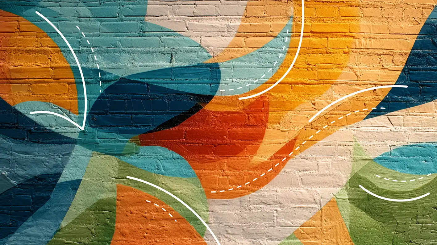 Colorful abstract geometric mural painted on a brick wall with layered shapes and curved white lines.