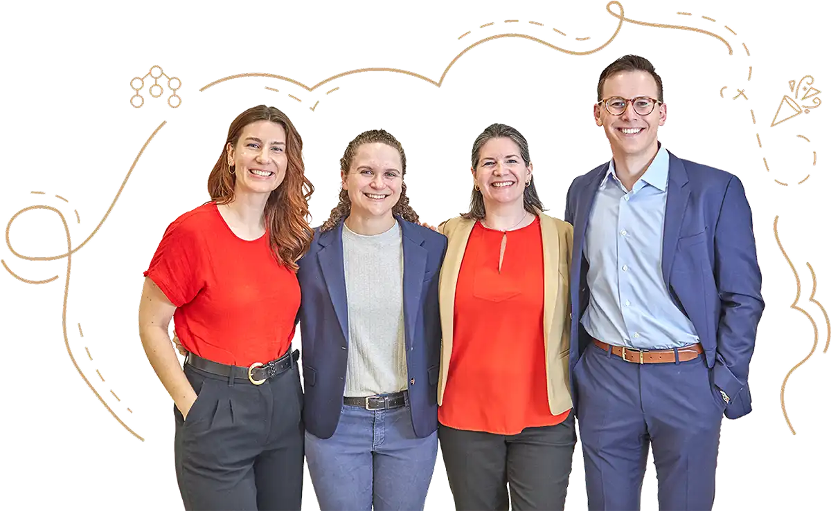 Four Eagle Hill Consulting team members standing together and smiling, illustrating employee experience insights, workplace collaboration, and organizational culture research.
